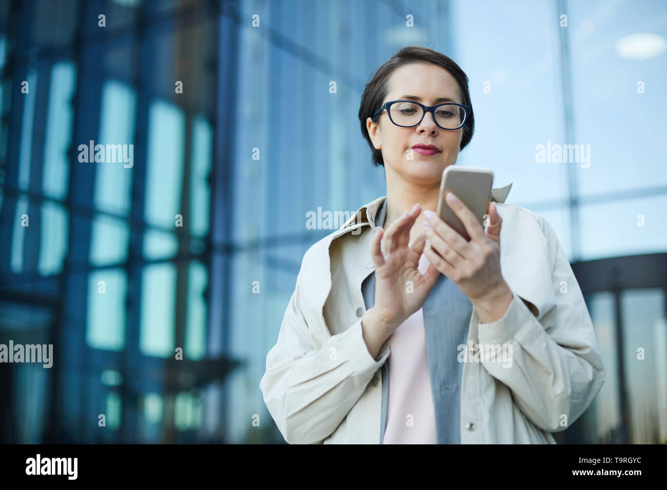 Busy woman checking email Stock Photo