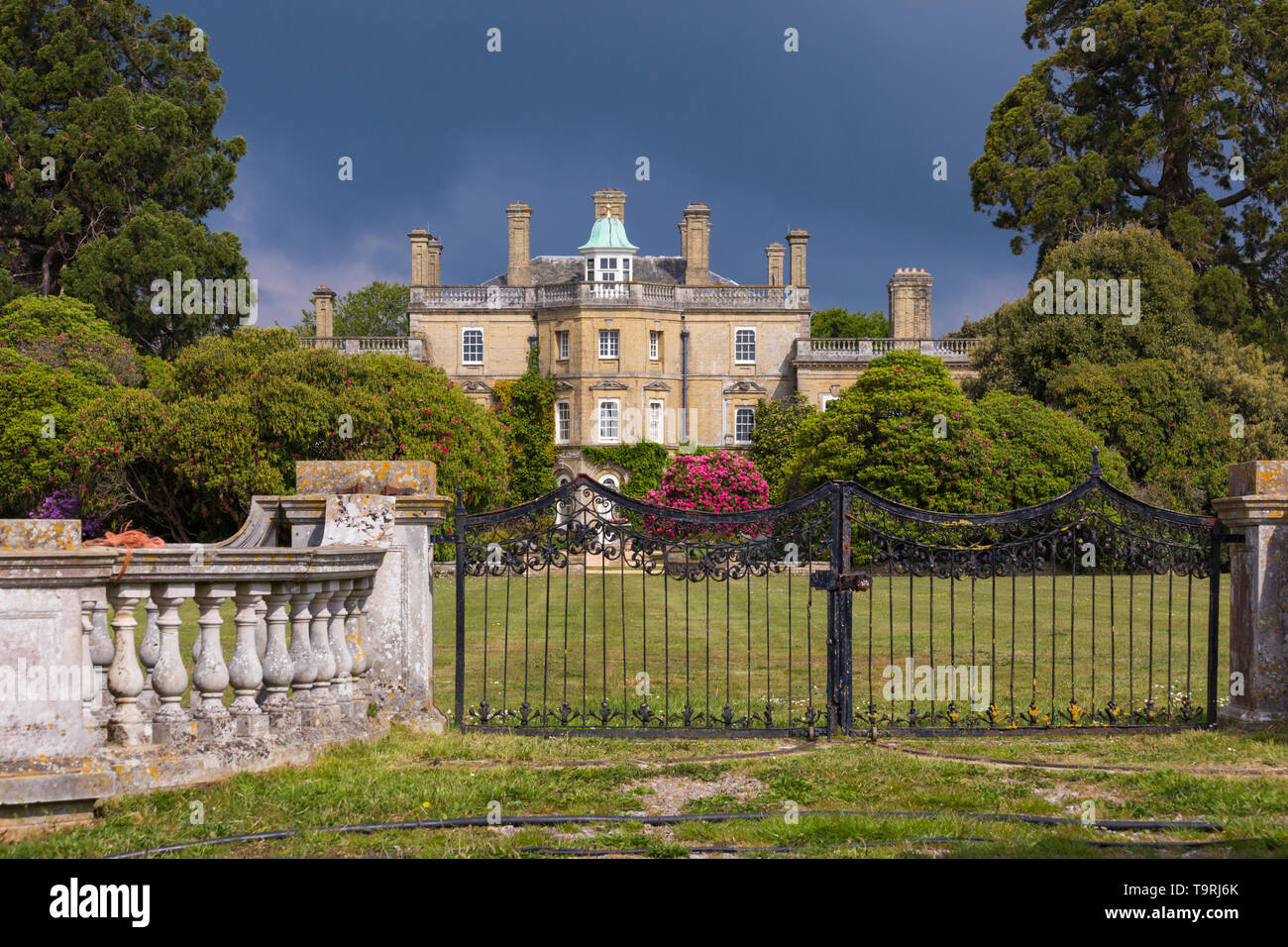 Dramatic lighting over Pylewell House, Pylewell Park Estate, Lymington, New Forest, Hampshire, UK in May Stock Photo