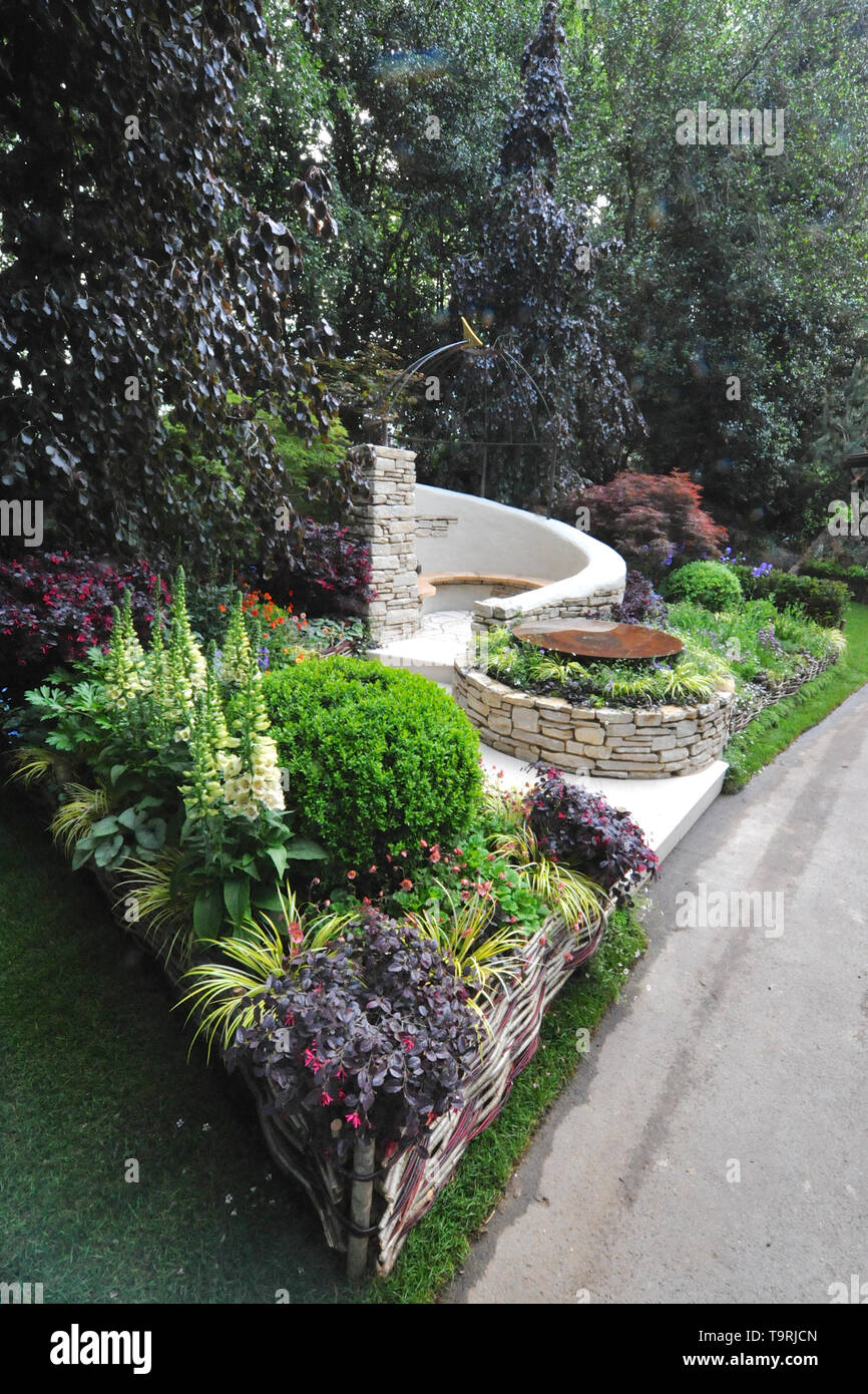 The Kingston Maurward Garden (designed by Michelle Brown), , one of the six beautiful and elegant Artisan gardens on display at the 2019 RHS Chelsea Flower Show which opened today in the 11-acre grounds of the Royal Hospital Chelsea, London, United Kingdom - 20 May 2019  The garden celebrates 70 years of land-based education at Kingston Maurward College. Over the years the college has taught generations of professionals artisanal craft techniques and how to work with beautiful materials which have been reflected in the garden’s design.  There are 26 themed gardens on display at this year’s sho Stock Photo