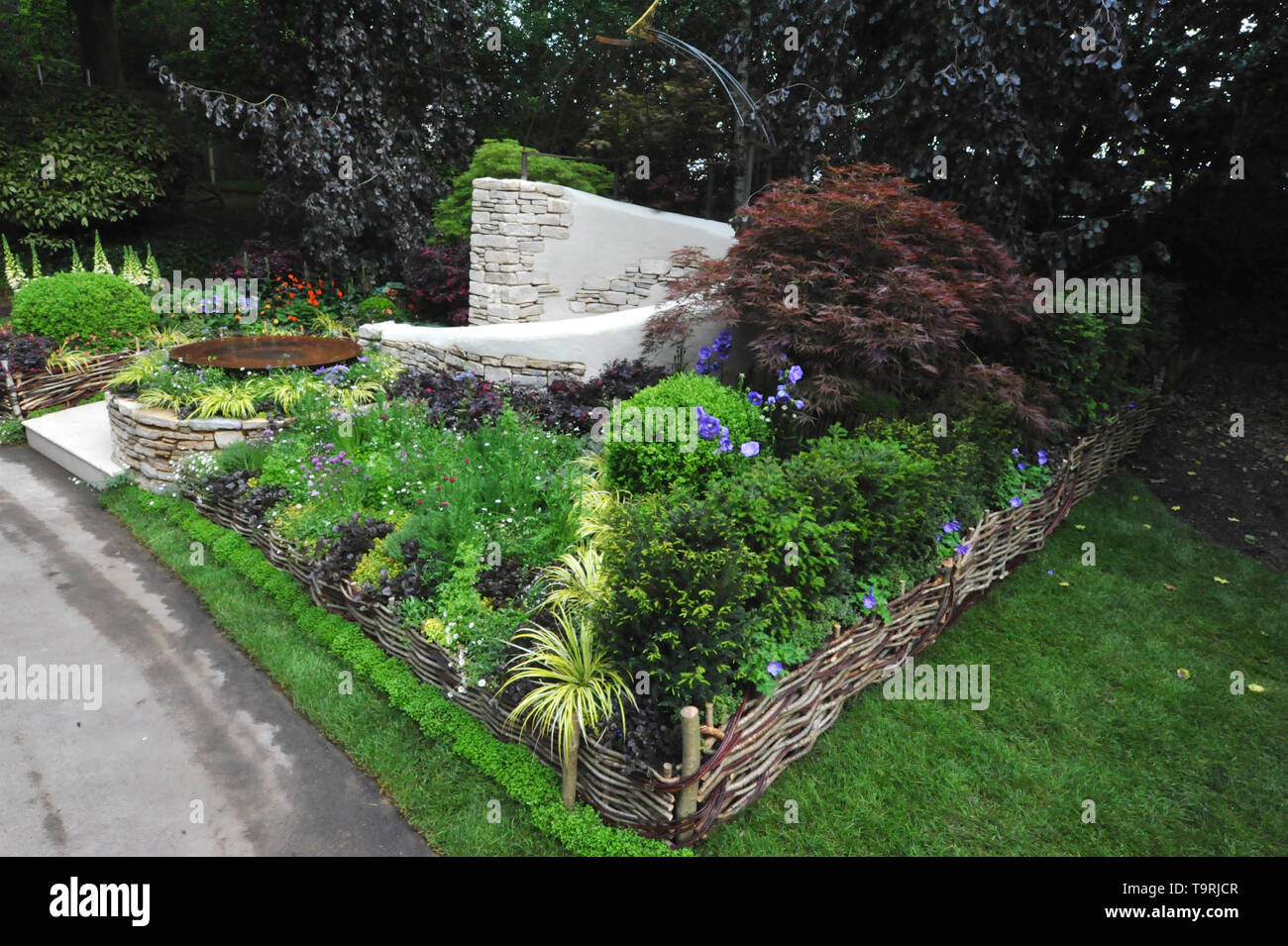 The Kingston Maurward Garden (designed by Michelle Brown), , one of the six beautiful and elegant Artisan gardens on display at the 2019 RHS Chelsea Flower Show which opened today in the 11-acre grounds of the Royal Hospital Chelsea, London, United Kingdom - 20 May 2019  The garden celebrates 70 years of land-based education at Kingston Maurward College. Over the years the college has taught generations of professionals artisanal craft techniques and how to work with beautiful materials which have been reflected in the garden’s design.  There are 26 themed gardens on display at this year’s sho Stock Photo