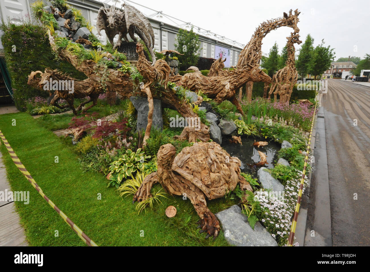 Rustic animal sculptures on display at the 2019 RHS Chelsea Flower Show which opened today in the 11-acre grounds of the Royal Hospital Chelsea, London, United Kingdom - 20 May 2019  Held since 1913, the five day event is the most prestigious flower and garden show in the United Kingdom, and perhaps in the world, and attracts around 168,000 visitors each year.  There are 26 themed gardens on display at this year’s show as well as over 100 plant displays in the Great Pavilion. New plants are often launched at the show and the popularity of older varieties revived, it is, in effect, the garden d Stock Photo