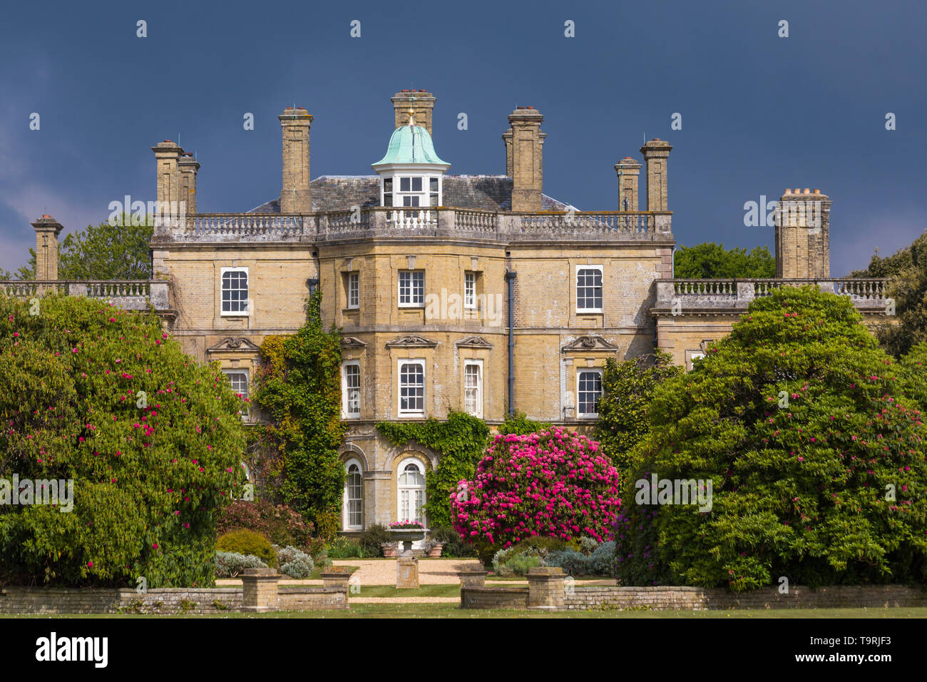 Dramatic lighting over Pylewell House, Pylewell Park Estate, Lymington, New Forest, Hampshire UK in May Stock Photo