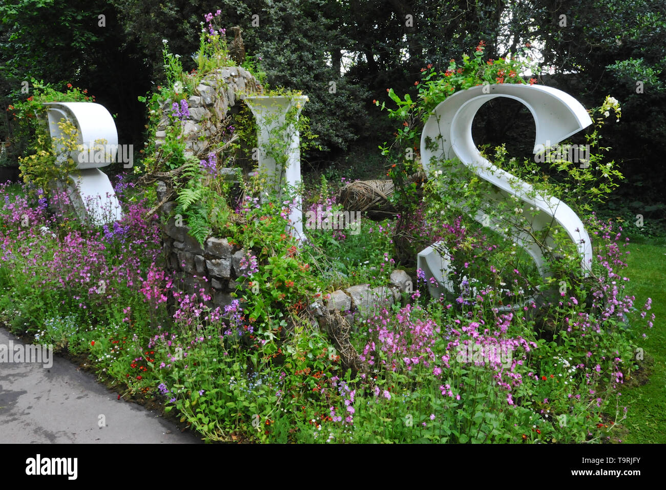 Wild Walls, an installation wrapping around the letters RHS (Royal Horticultural Society) on display at the 2019 RHS Chelsea Flower Show which opened today in the 11-acre grounds of the Royal Hospital Chelsea, London, United Kingdom - 20 May 2019  There are 26 themed gardens on display at this year’s show as well as over 100 plant displays in the Great Pavilion. New plants are often launched at the show and the popularity of older varieties revived, it is, in effect, the garden design equivalent of a catwalk at a fashion show. Stock Photo