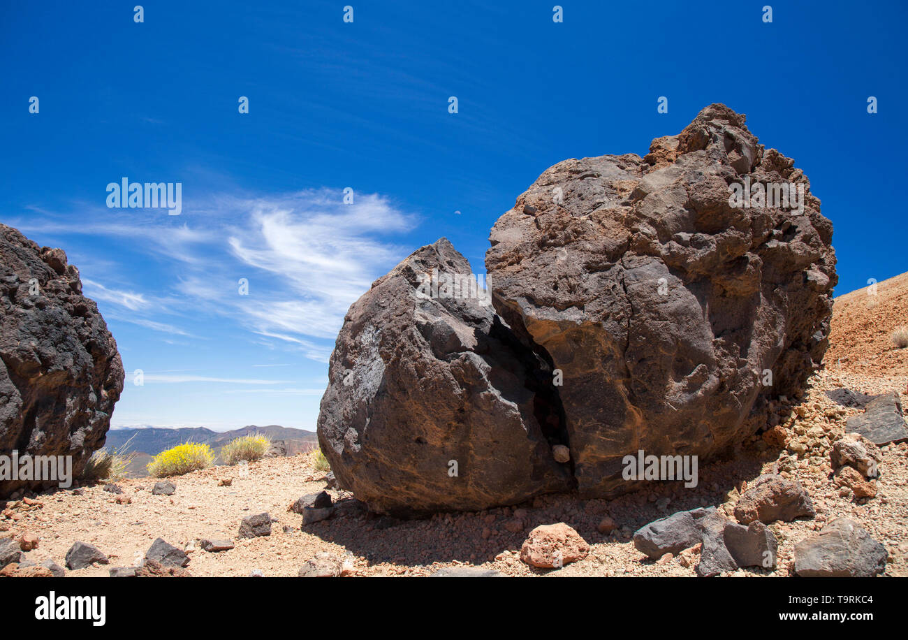 Tenerife, view from hiking path to the summit towards dark lava bombs called Huevos del Teide, Eggs of Teide Stock Photo