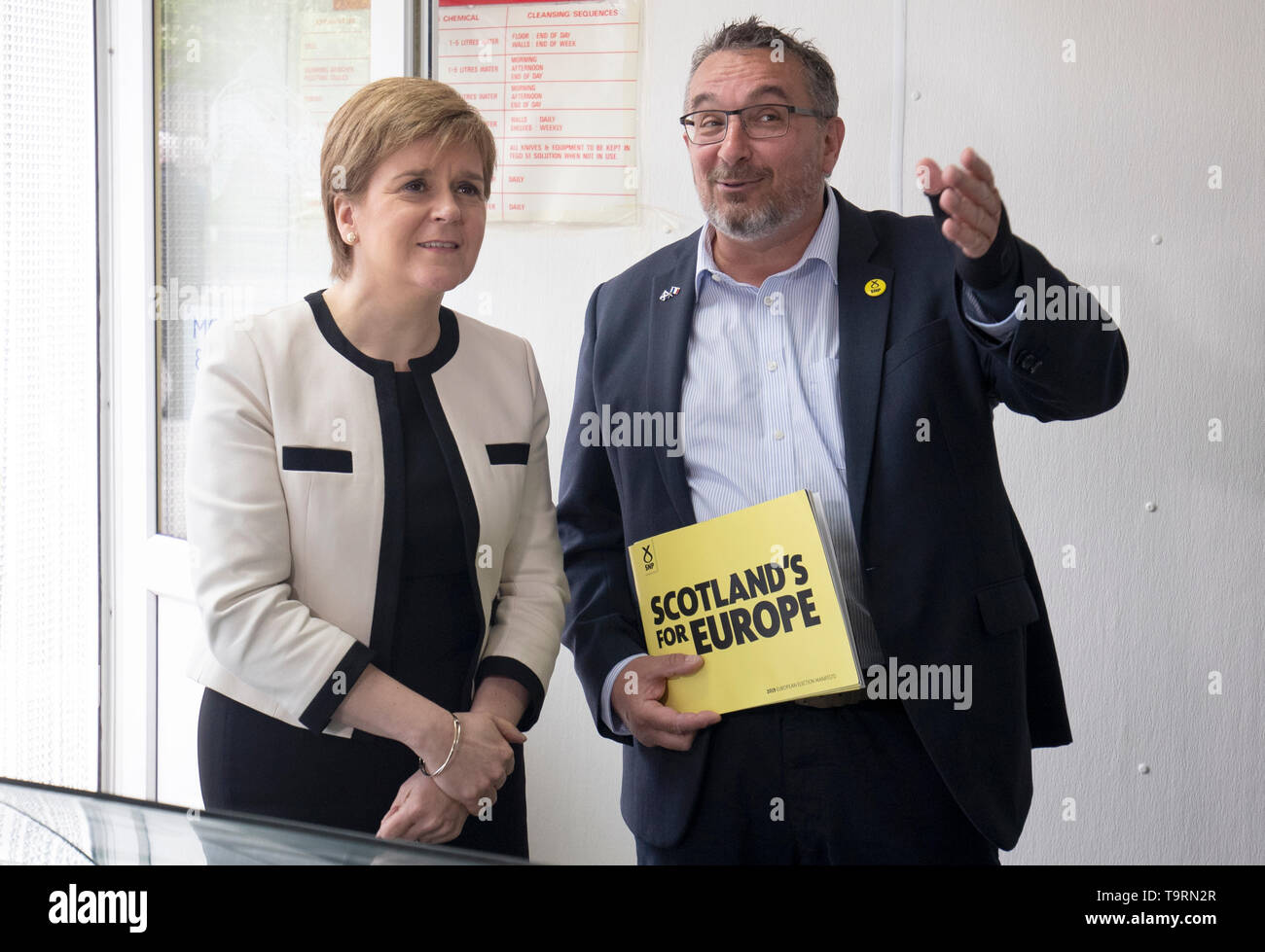 First Minister Nicola Sturgeon with SNP European election candidate Christian Allard during a visit to J Charles Ltd seafood processing plant in Aberdeen. Christian Allard worked at J Charles Ltd for 25 years exporting seafood to the continent, before he entered politics. Stock Photo