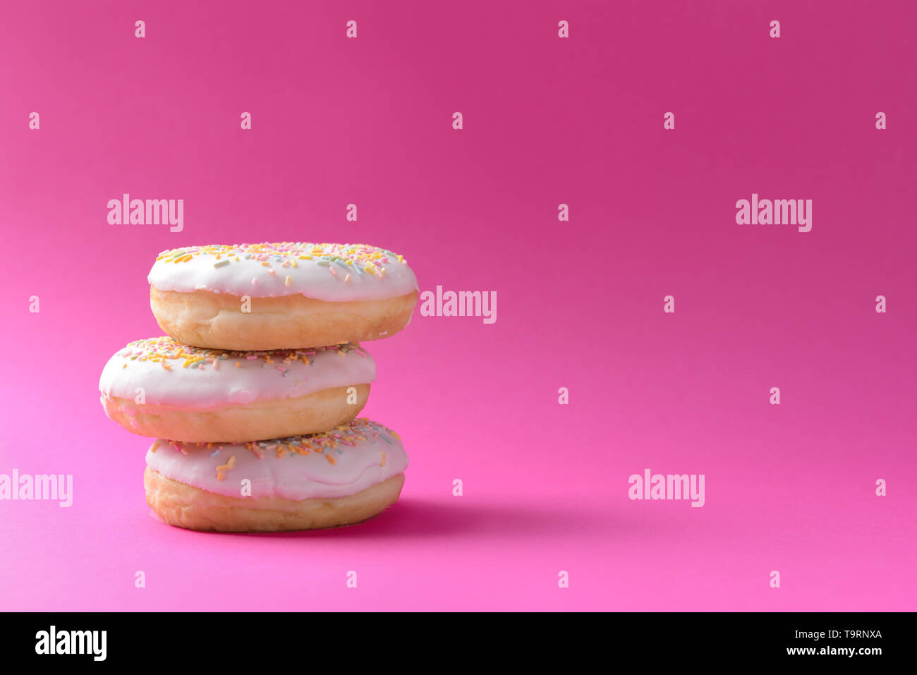 Tasty doughnuts on color background Stock Photo