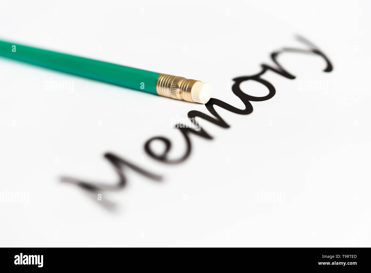 A pencil with an eraser and the word "memory" with a blurry start and ending. The concept of memory problems, oblivion. Stock Photo