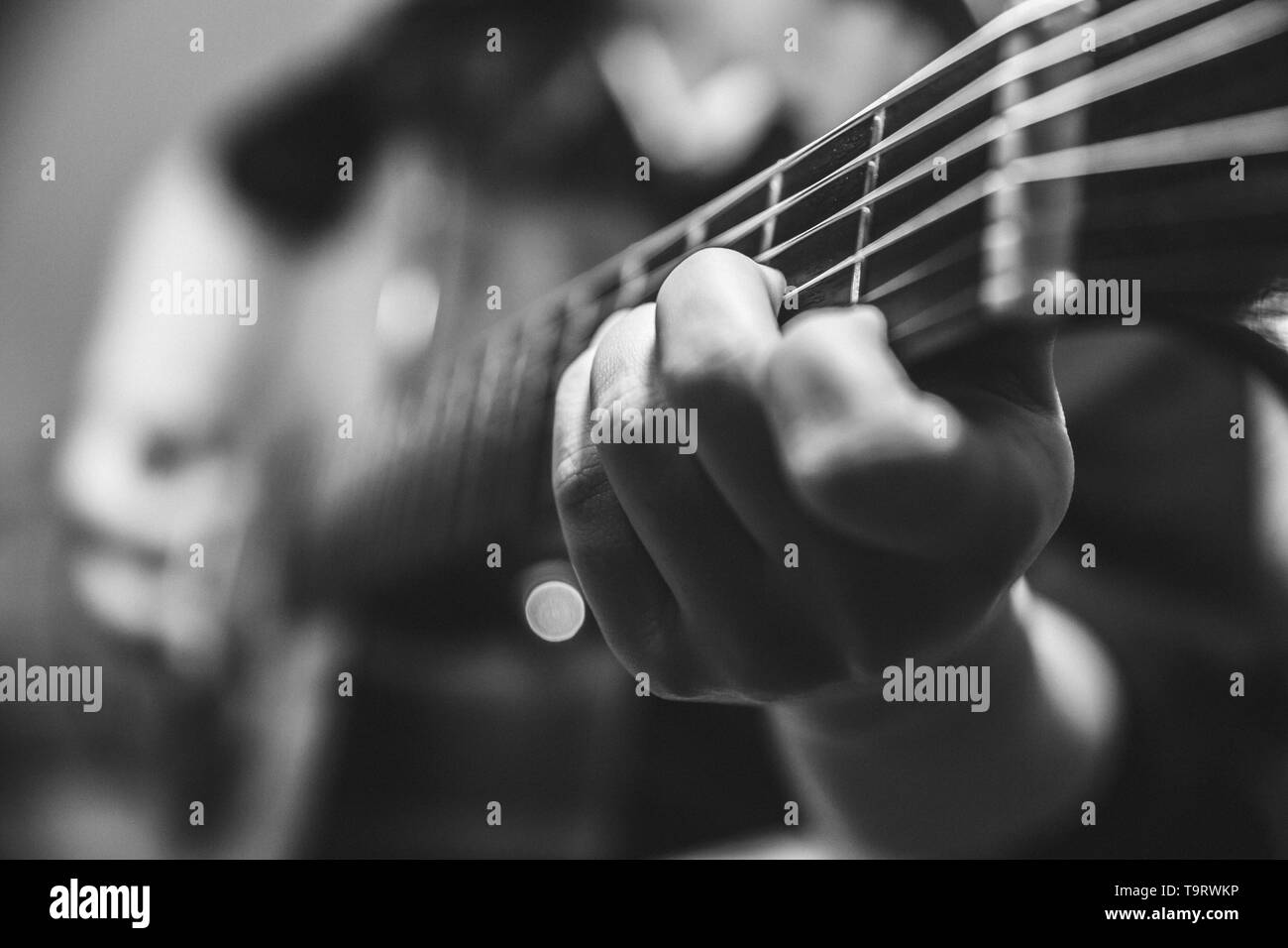 musician guitar player plays the guitar closeup vintage tone with noise