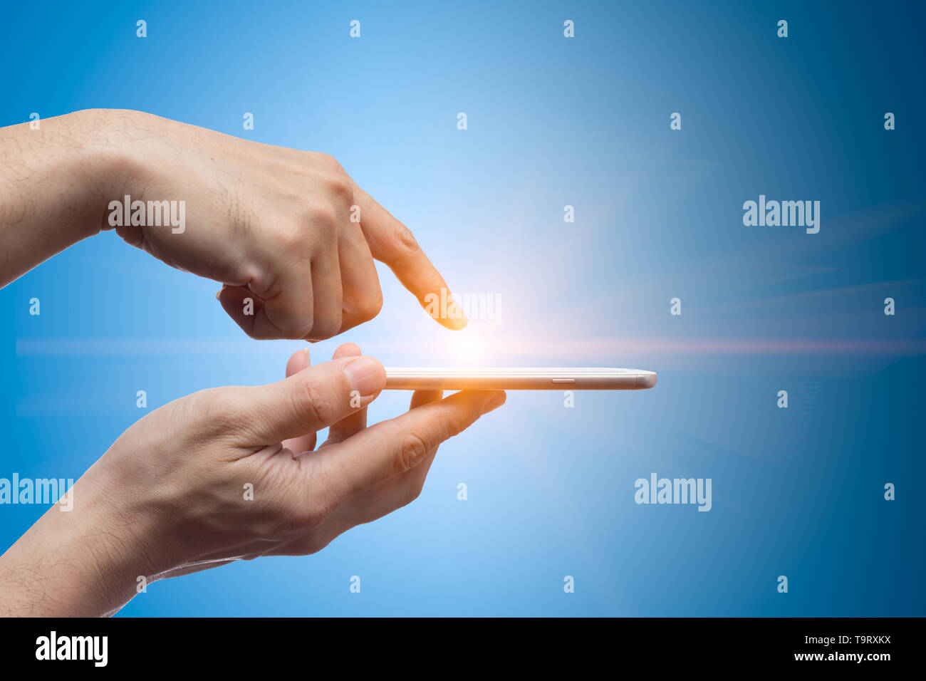 smartphone touch screen with light up finger smart access with modern innovation device concept Stock Photo