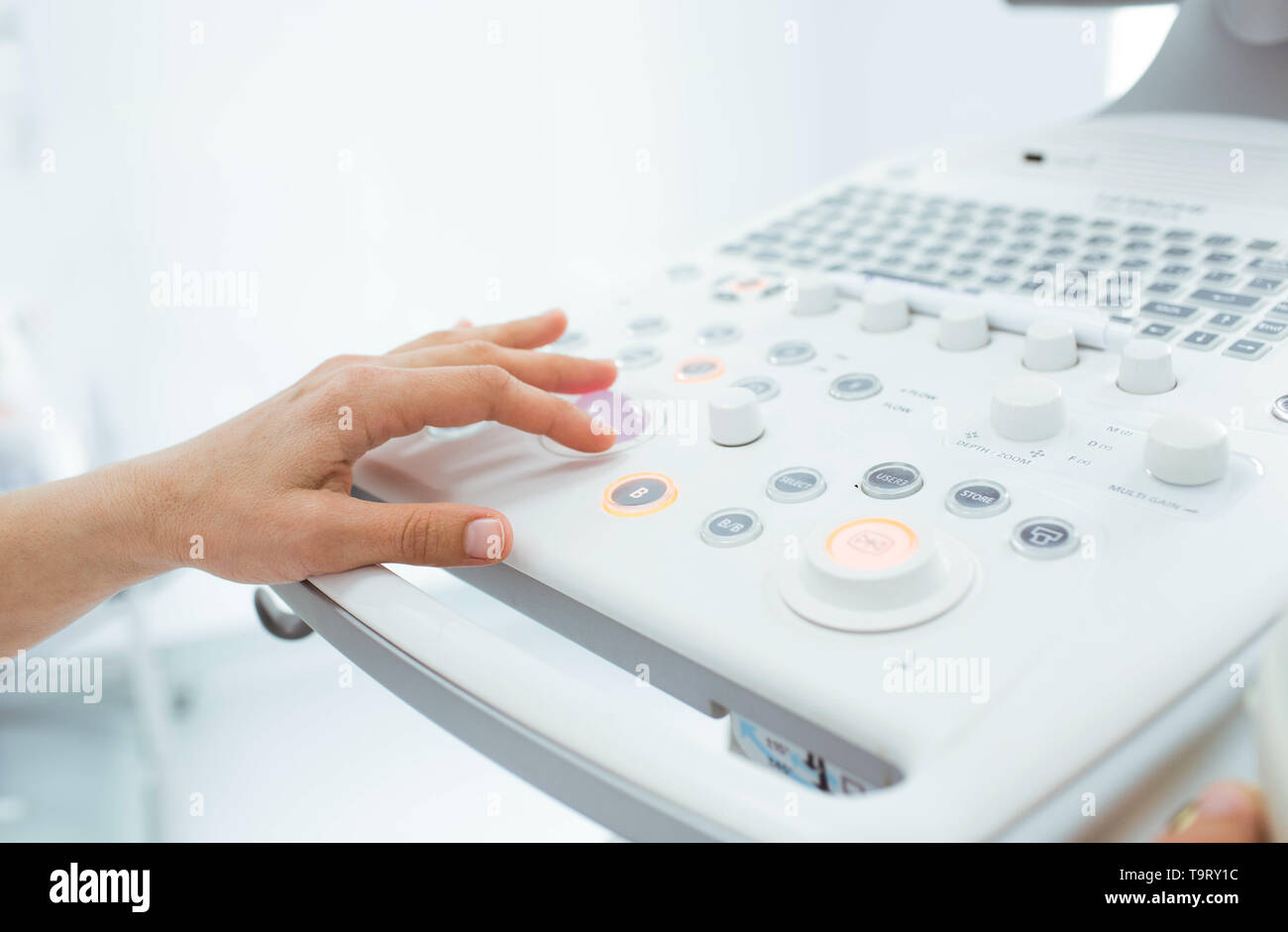 Gynecologist preparing her ultrasound for an examination pregnant woman. Stock Photo