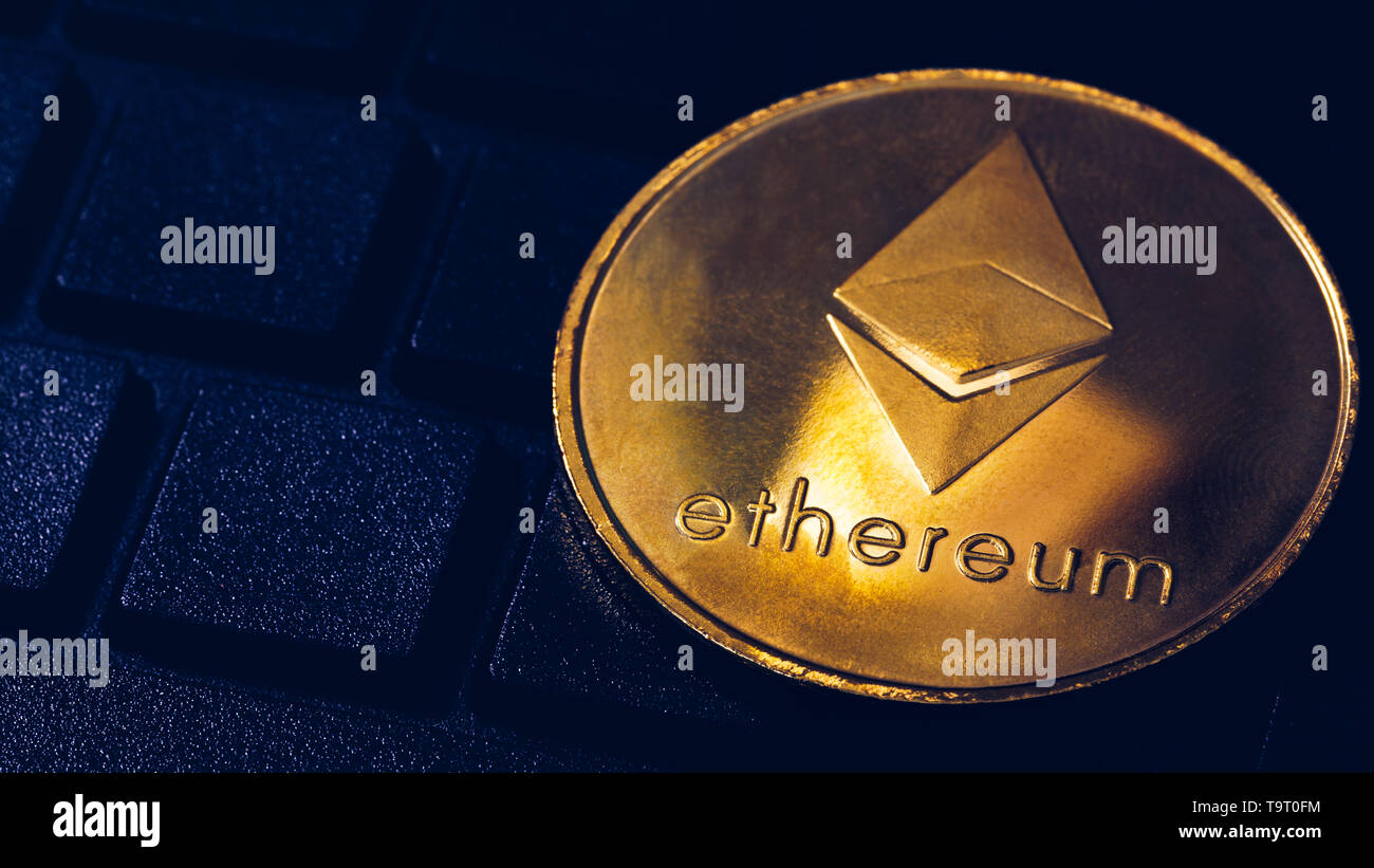 Ethereum cryptocurrency (crypto currency). Silver Ethereum coin with gold Ethereum symbol. ETHEREUM (ETH) cryptocurrency. Stock Photo