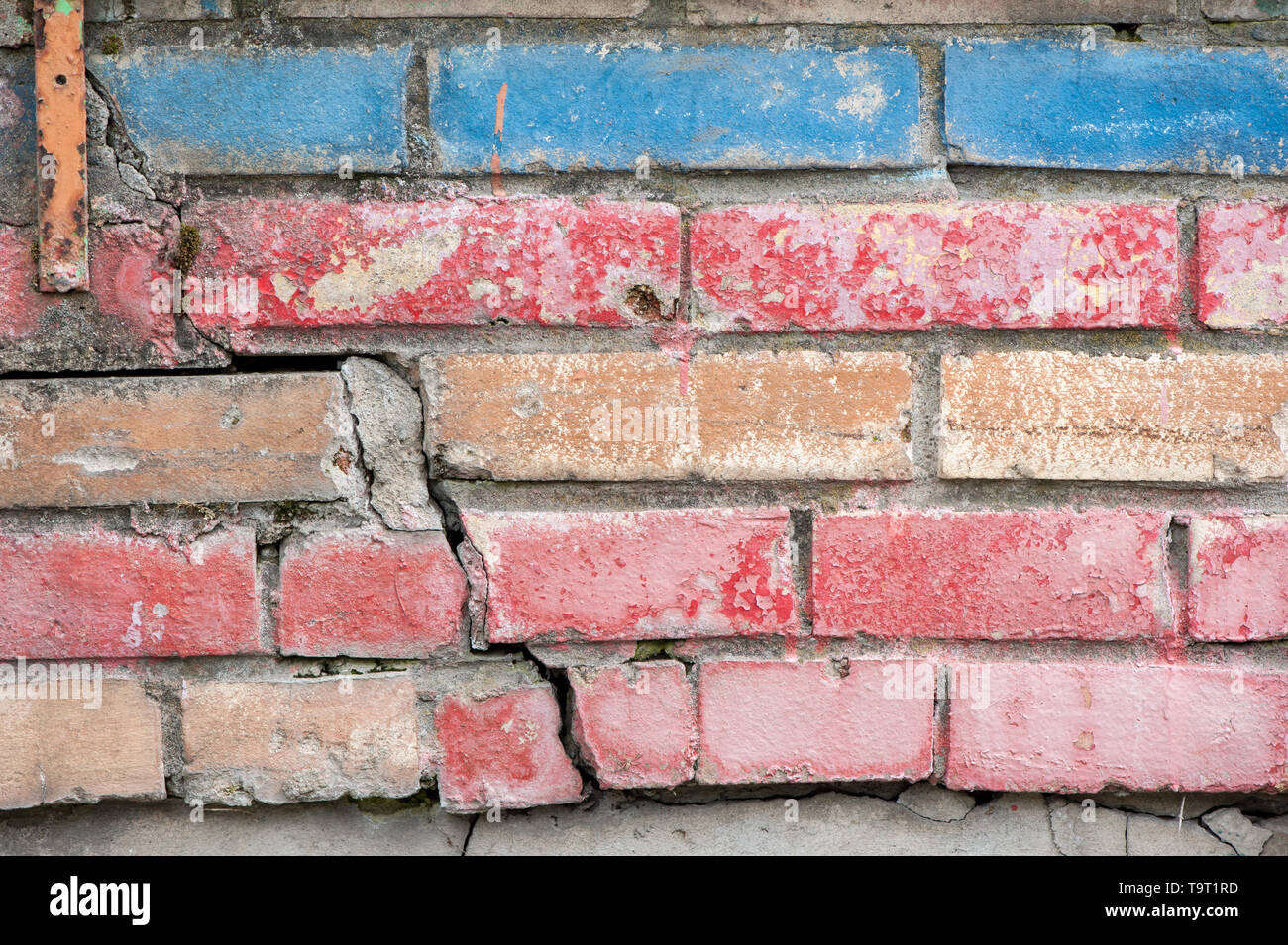 Weathered stained old brick wall for texture or background Stock Photo