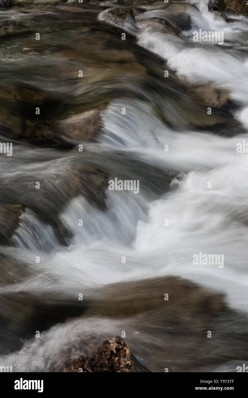 Silky moving water in the Arroyo del Salto near the Chorillo del Salto waterfall in Los Glaciares National Park near El Chalten, Argentina.  A UNESCO  Stock Photo