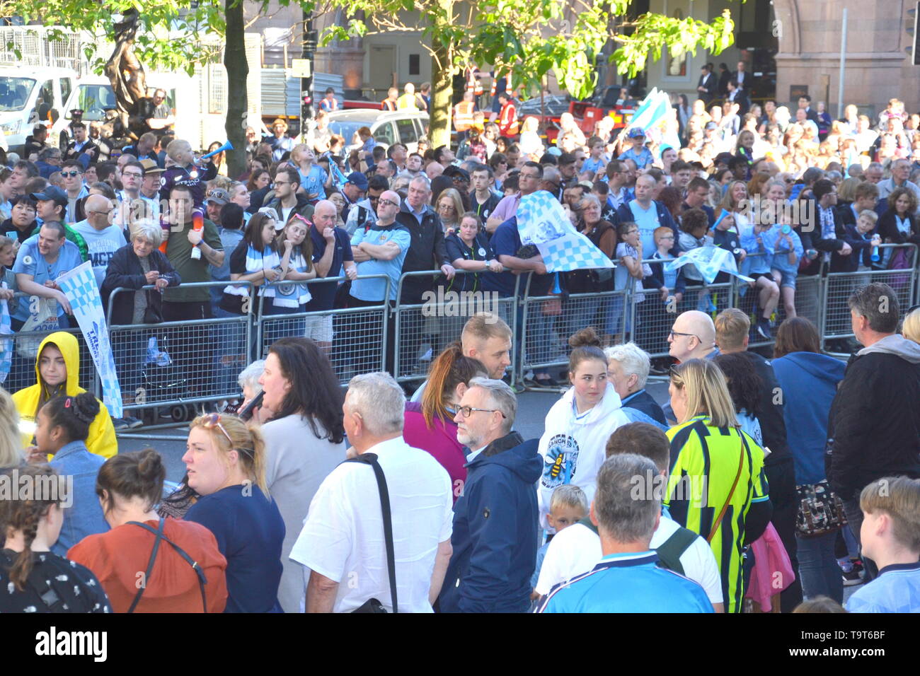 20th May, 2019. Supporters wait for Manchester City Football Club Champions Trophy Parade beside Manchester Town Hall Stock Photo
