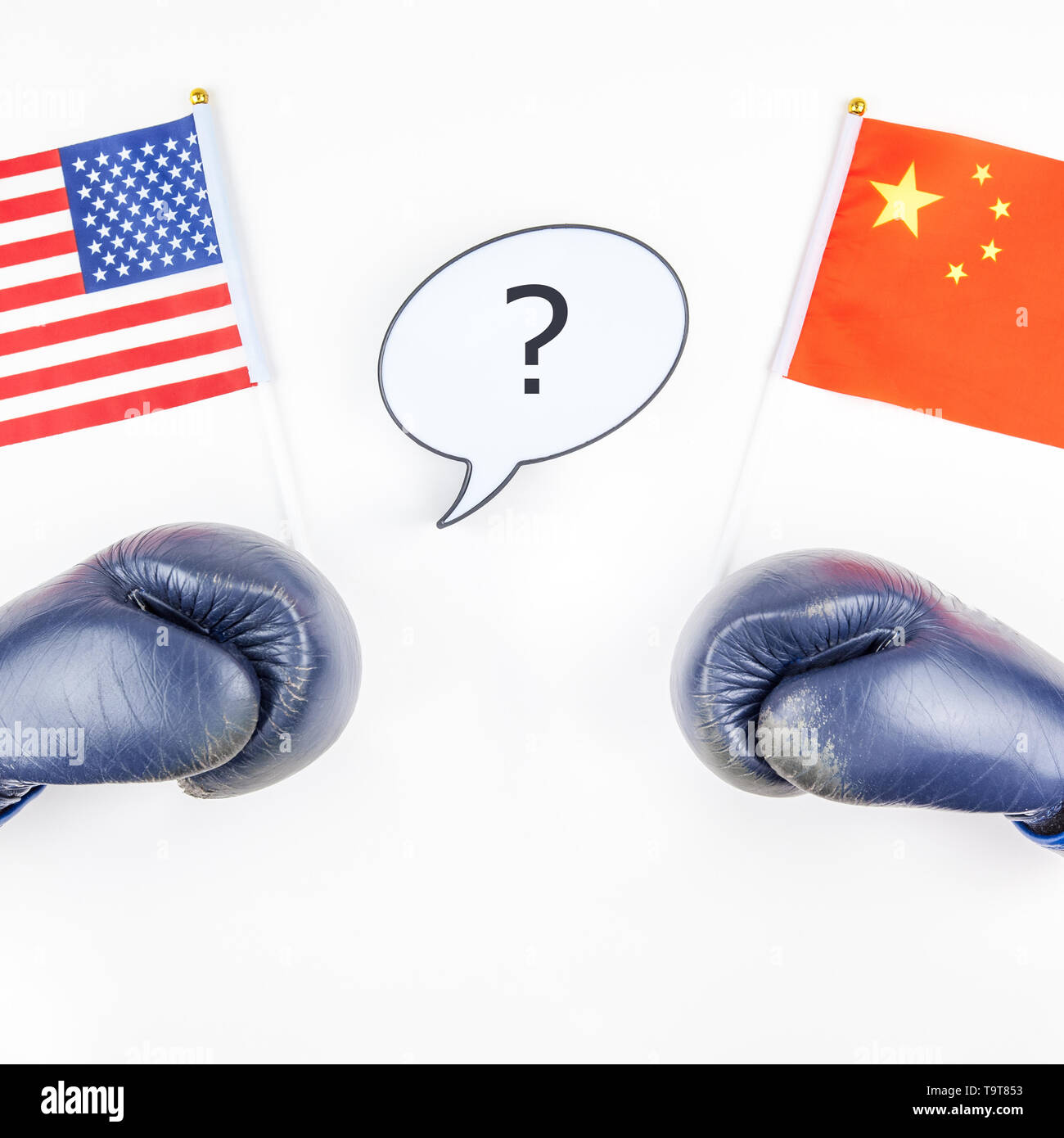 Creative top view flat lay of Two boxing gloves with China and USA flag bubble lightbox with question mark and copy space white background in minimal  Stock Photo