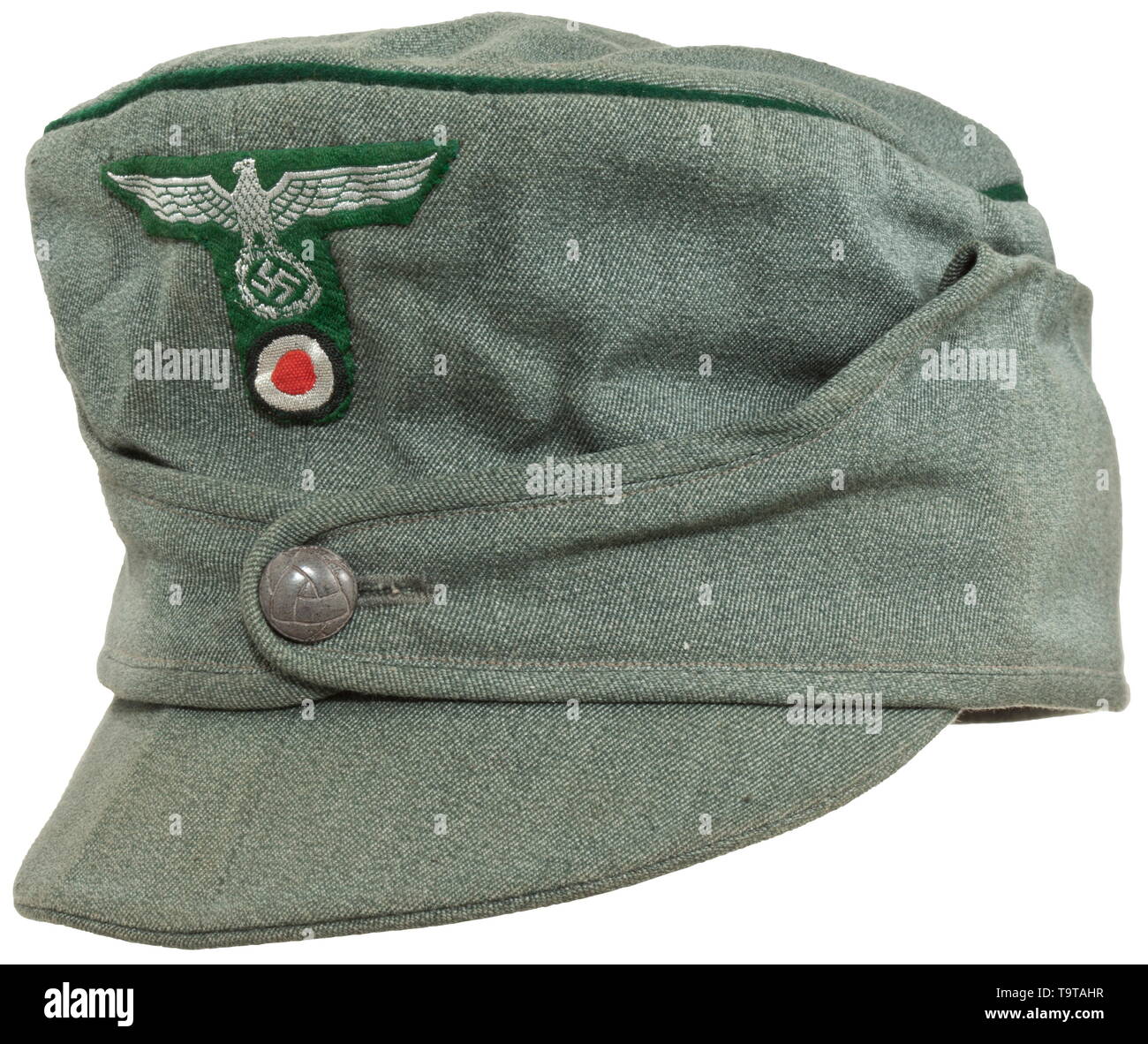 A mountain cap for members of the land customs Fine mottled green cloth, dark green piping, grey Bakelite button, BeVo-woven eagle in T-shape in officer's version, orange-coloured inner liner with depot's ('O.F.P.J.') and size stamps ('58'), brown leather sweatband. Light signs of usage. historic, historical, State, state-controled, state-run, organisations, organizations, organization, organisation, object, objects, stills, clipping, clippings, cut out, cut-out, cut-outs, utensil, piece of equipment, utensils, 20th century, Additional-Rights-Clearance-Info-Not-Available Stock Photo