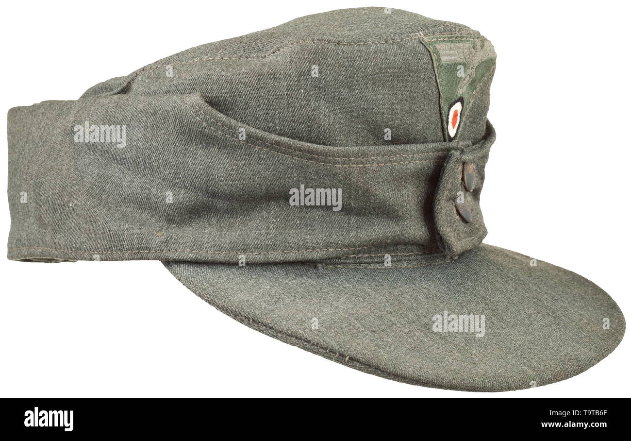 A field cap M 43 for enlisted men/NCOs of the army depot piece from looted Italian cloth Grained iron buttons, machine-stitched cap trapezoid (machine-embroidered issue), grey silk liner with RB-, size- and depot stamps. Only lightly used. historic, historical, army, armies, armed forces, military, militaria, object, objects, stills, clipping, clippings, cut out, cut-out, cut-outs, 20th century, Editorial-Use-Only Stock Photo