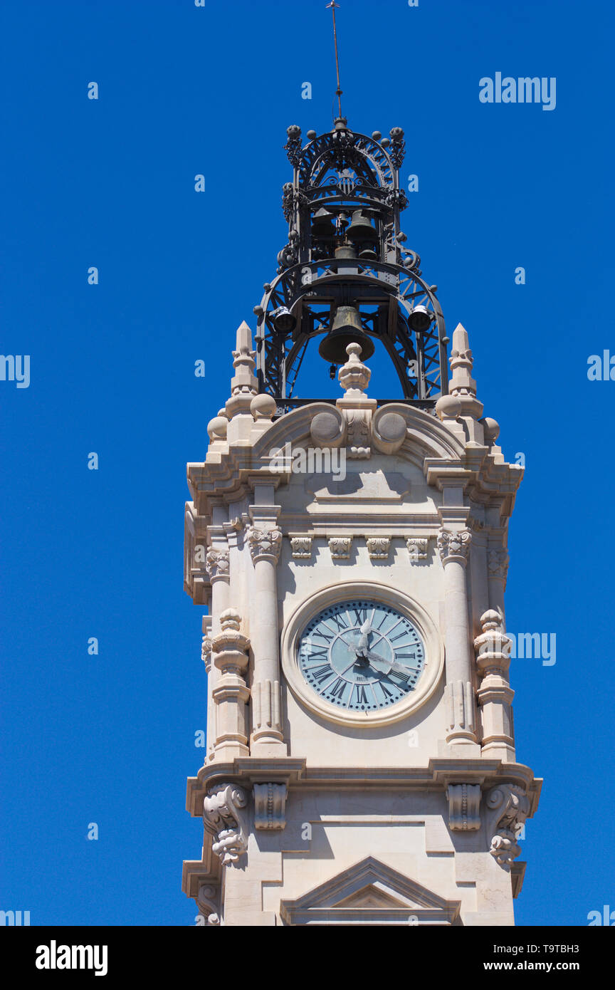 Close-up of the tower with clock and bell chime of the Neo-Baroque and Neo-Renaissance style building where the Town Hall of Valencia (Spain) is curre Stock Photo