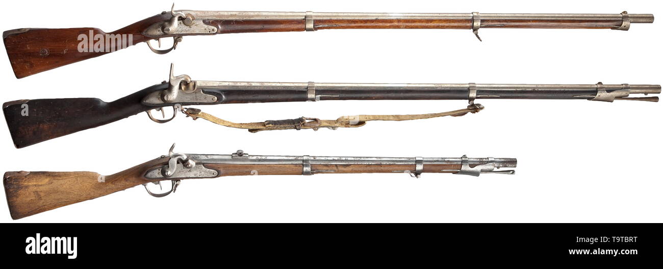 Three military rifles, 18th/19th century Two rifles with bright bores, one with rifled bore, each in 18 mm calibre. Converted percussion locks, lock mechanisms partly slow or defective. Walnut fullstocks with iron furniture. All rifles reworked in parts with incorrect replacements. Signs of usage and age. Length 114 to 145 cm. historic, historical, France, French, 19th century, 18th century, Additional-Rights-Clearance-Info-Not-Available Stock Photo