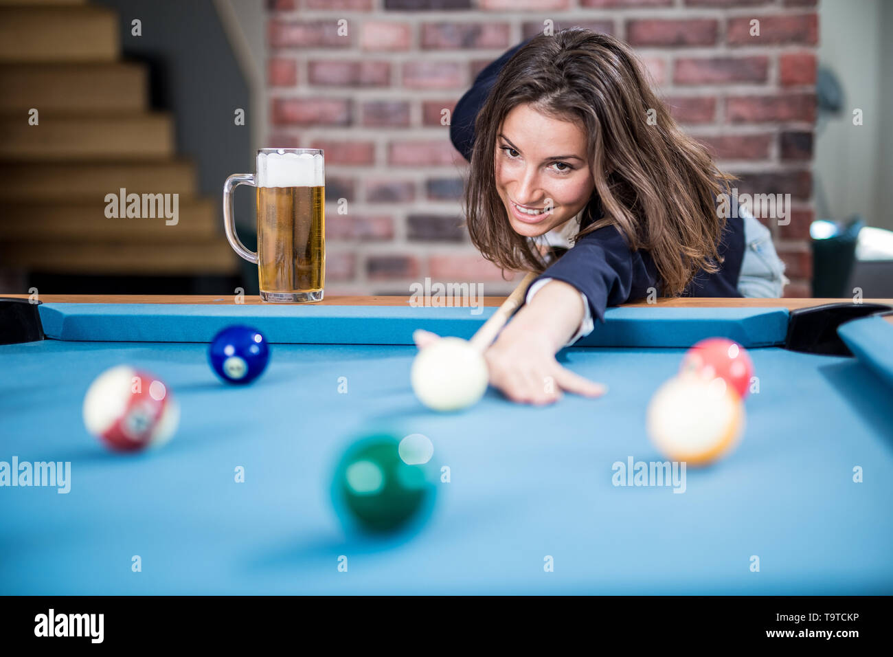 Premium Photo  Beautiful young girl came on a weekend to play billiards  for curiosity concept of a girl playing billiards