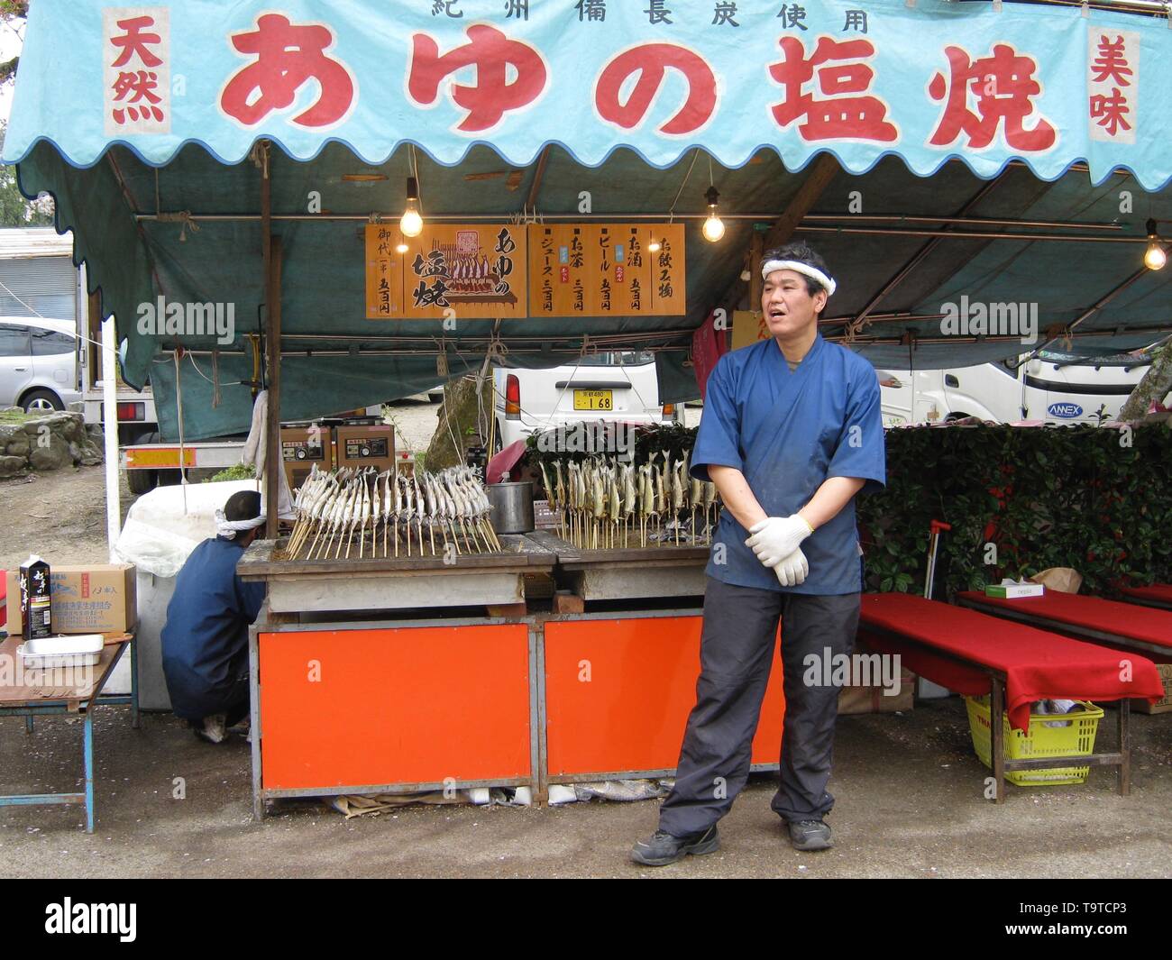 Japanese food vendors at a stall at cherry blossom time in tokyo, Japan