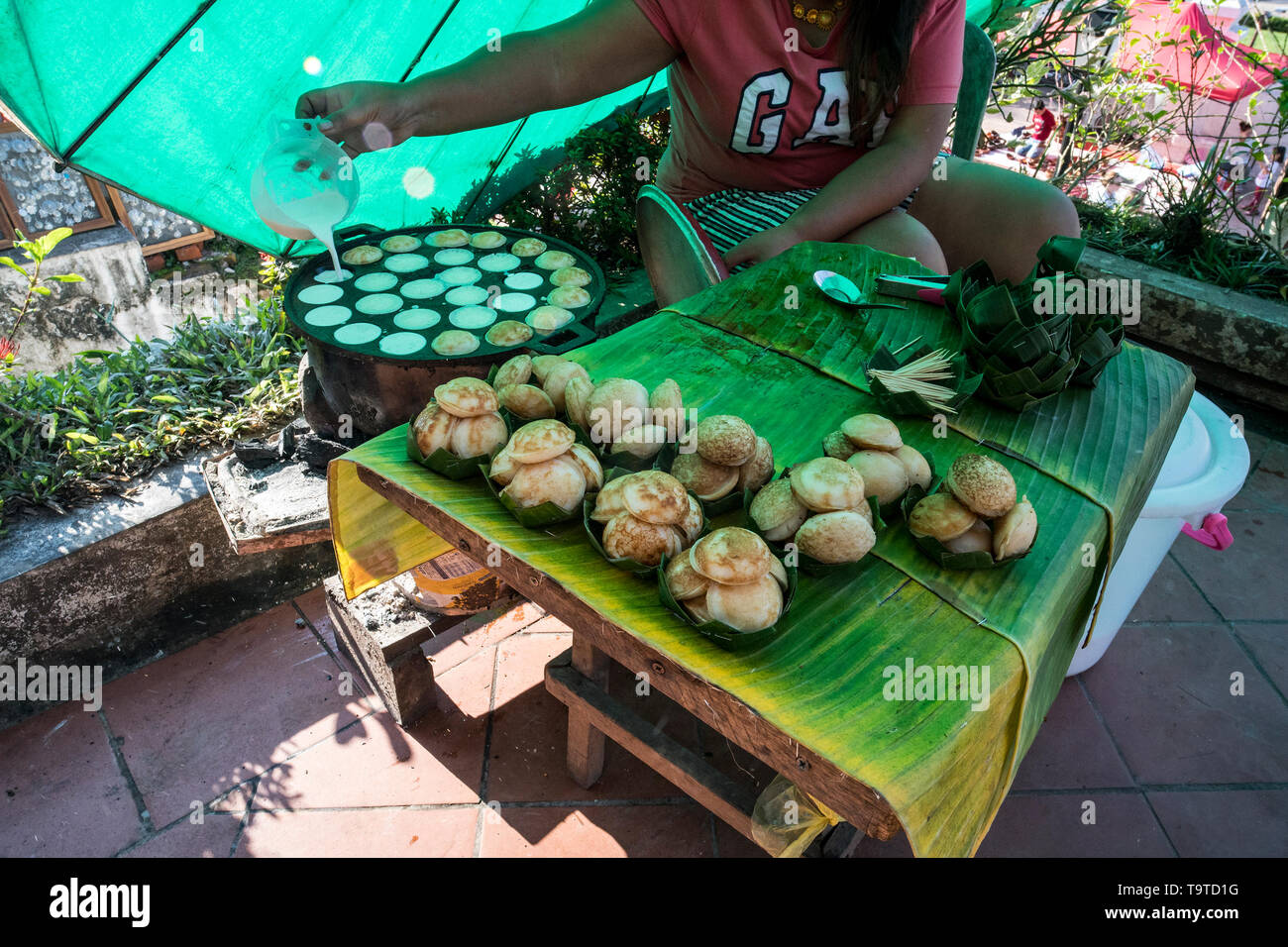 Cooking for Sweet and Savory Grilled Coconut-Rice Hotcakes it's for kanom krok but sometimes they use Coconut Rice Cake, Thai coconut pudding too. Tha Stock Photo
