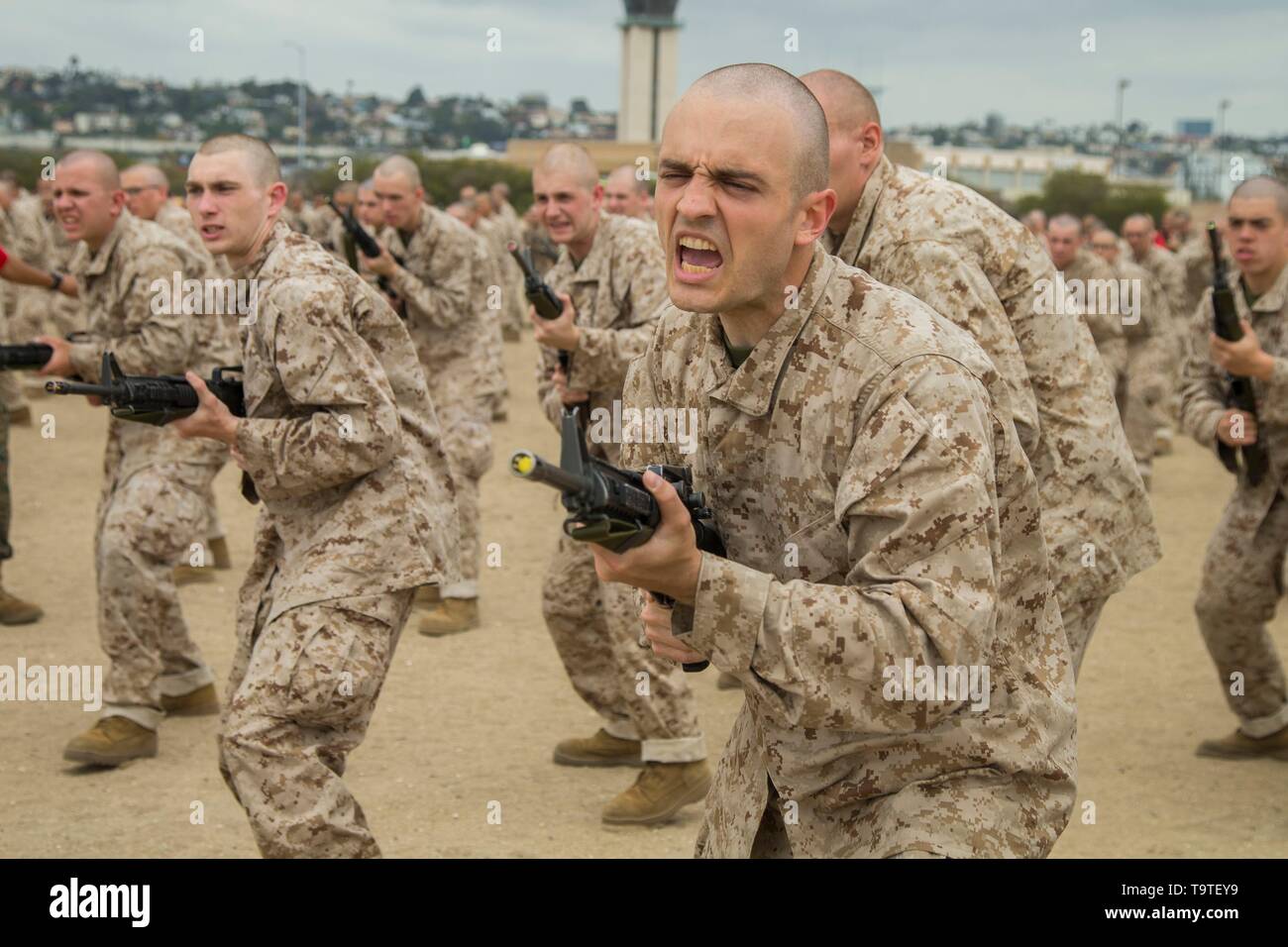 U.S. Marine recruits with Bravo Company, 1st Recruit Training Battalion, practice bayonet techniques during the Bayonet Assault Course at Marine Corps Recruit Depot San Diego May 15, 2019 in San Diego, California. Stock Photo