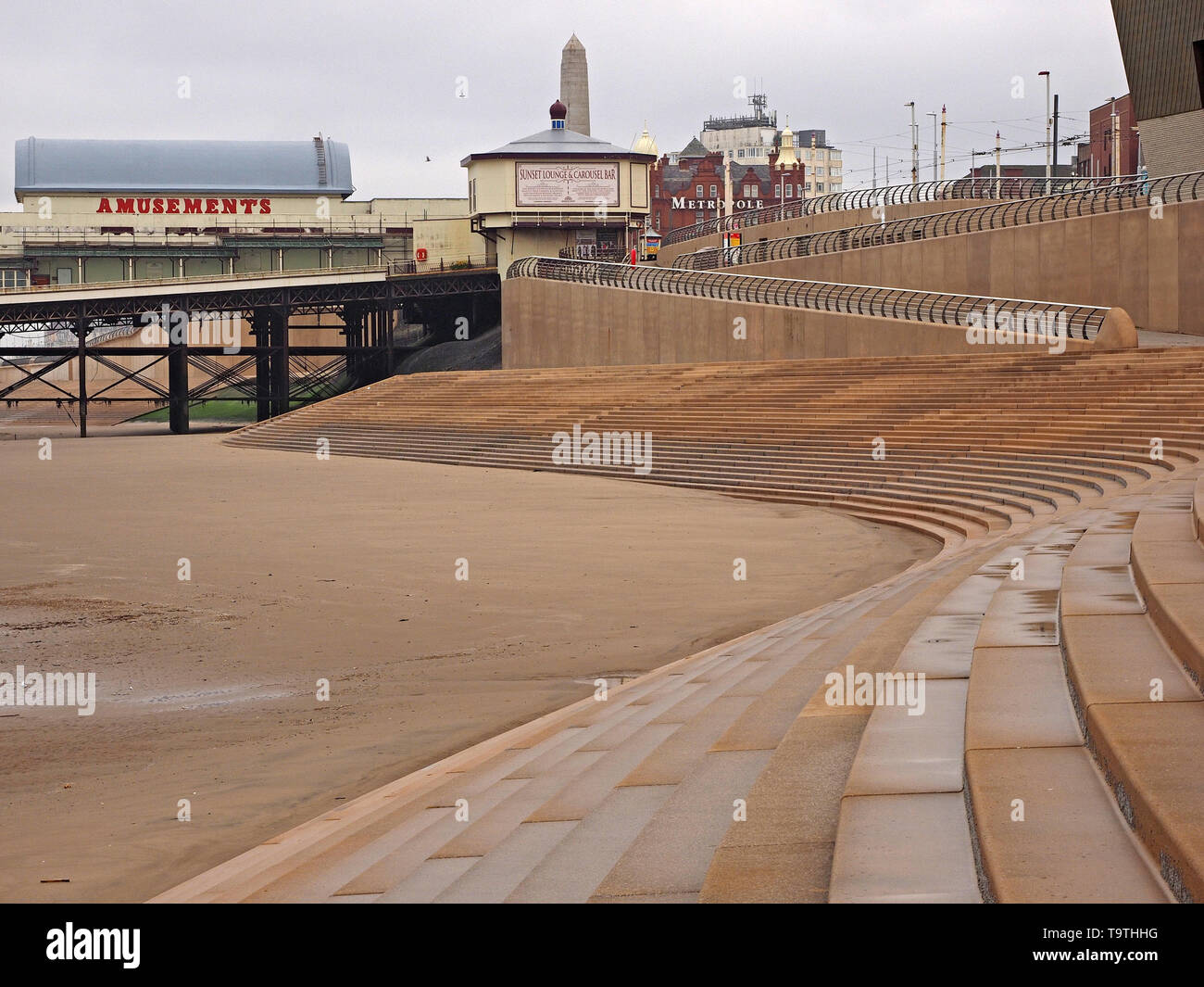 Curved lines of stone steps and modern railings create patterns on the ...