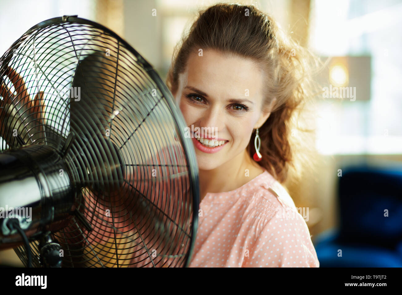 Working fan blowing person hi-res stock photography and images - Alamy