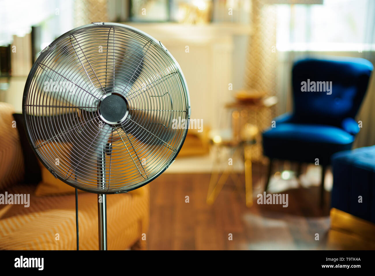 Closeup On Working Electric Floor Standing Fan In The Modern House