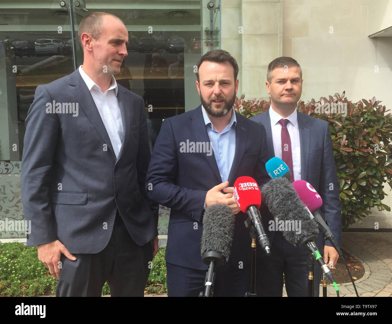 SDLP leader Colum Eastwood (centre) speaks to the media outside Stormont Hotel in Belfast. Political leaders in Northern Ireland have accused the Secretary of State for Northern Ireland Karen Bradley of employing delaying tactics to frustrate compensation payments for abuse victims. Stock Photo