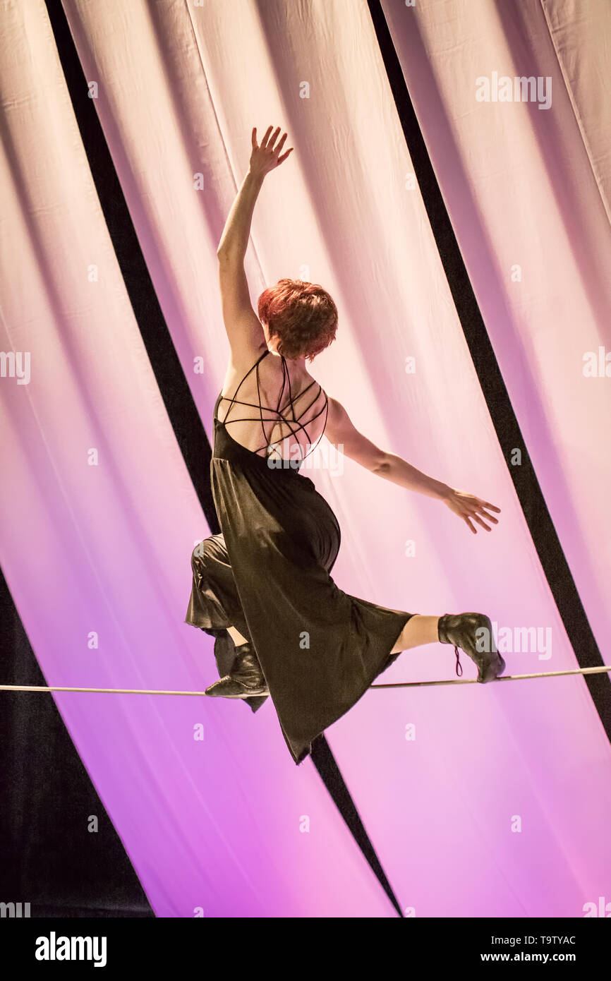 Female tightrope walker performs in a circus Stock Photo - Alamy