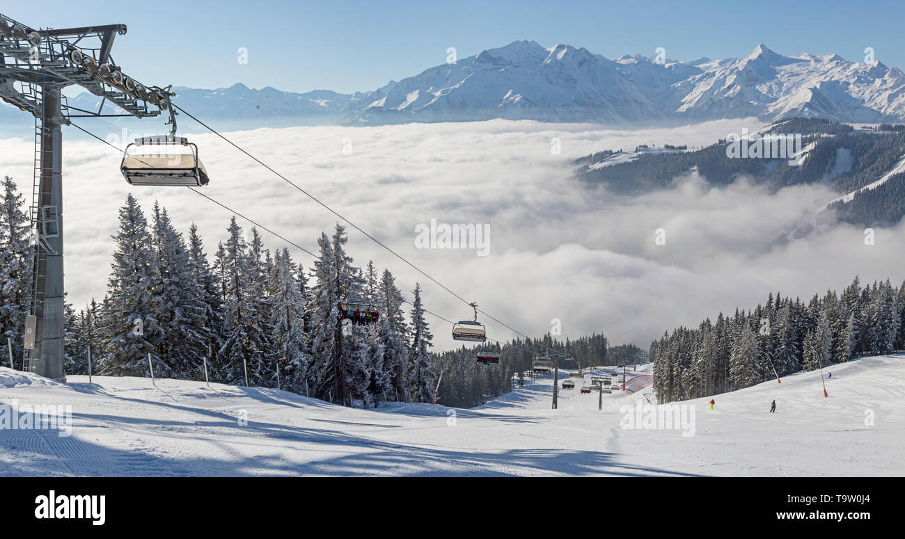 Winter view of a chair lift and ski piste at Zell Am See, Austria. Stock Photo