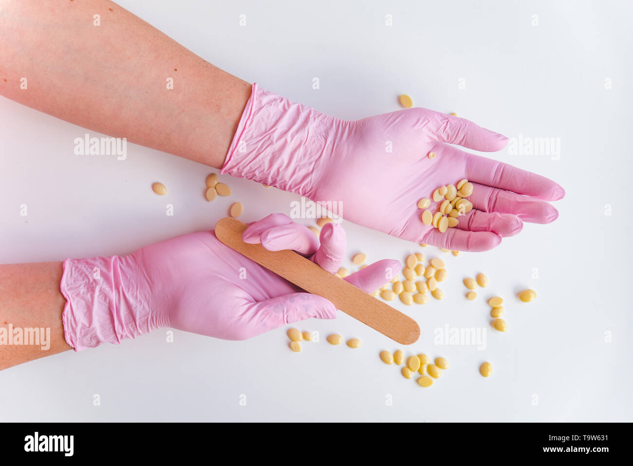 cosmetology concept. sugaring hair removal. hand in rubber gloves Stock