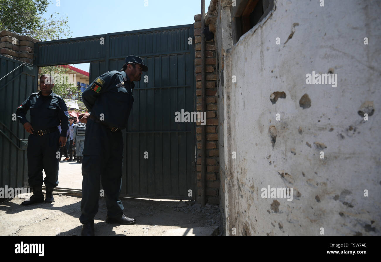 Kabul, Afghanistan. 20th May, 2019. Afghan police officers inspect an attacked security checkpoint in Kabul, capital of Afghanistan, May 20, 2019. Three police officers were killed after unknown men hurled a hand grenade on a security checkpoint on Sunday in Dough Abad, an area in Police District 7 of Kabul. Credit: Rahmat Alizadah/Xinhua/Alamy Live News Stock Photo
