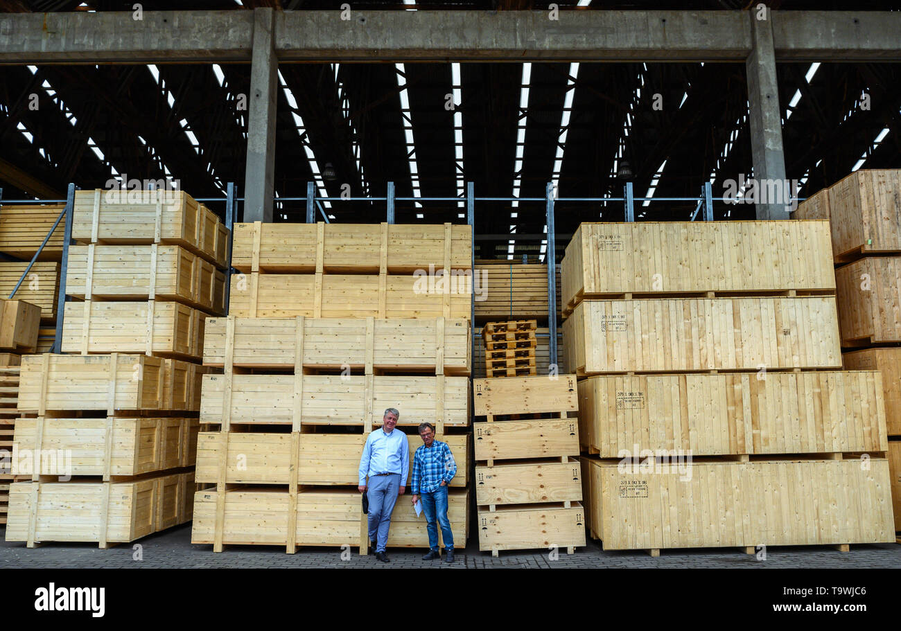 Bremen, Germany. 17th May, 2019. Markus Neumann (r), wood technician at the company 'Carl Gluud', and Jens Dörken, managing director of the company 'Carl Gluud', stand in front of stacked wooden transport boxes on their company premises. (to dpa 'Too big, too heavy? resourceful technicians get everything on the ship') Credit: Mohssen Assanimoghaddam/dpa/Alamy Live News Stock Photo