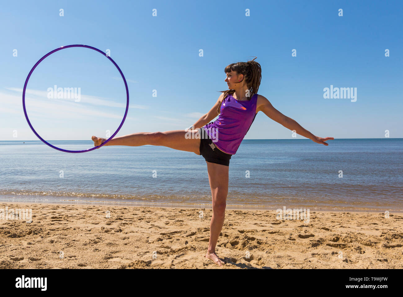 Southbourne, Bournemouth, Dorset, UK. 21st May, 2019. UK weather: lovely warm sunny morning as Lottie Lucid performs her hula hooping routine on the beach at Southbourne, enjoying the warm sunny weather in her hot pants. Credit: Carolyn Jenkins/Alamy Live News Stock Photo
