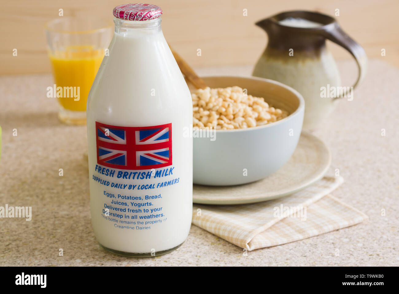 Fresh semi skimmed milk in a recyclable glass bottle delivered to the door step by a traditional milk man Stock Photo