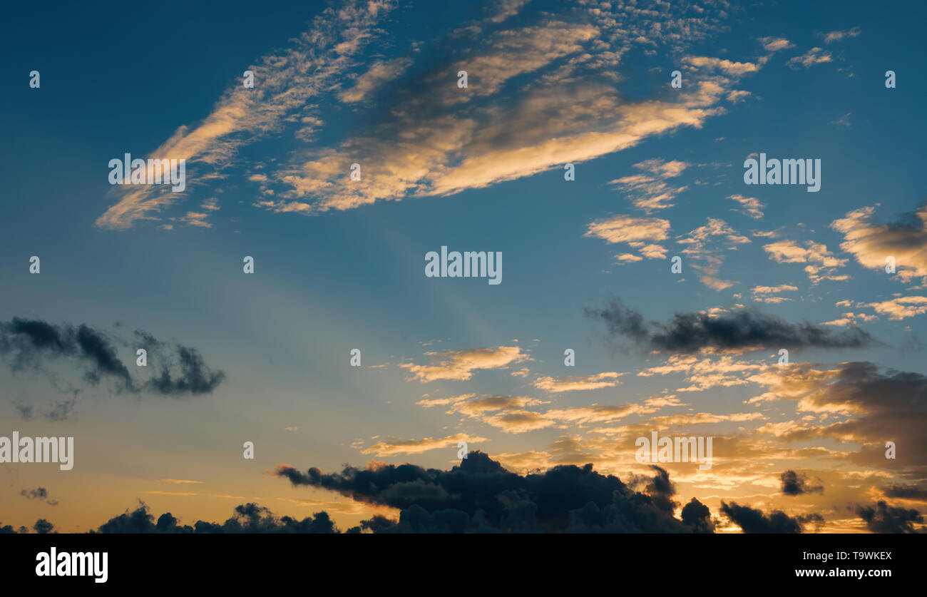 Dramatic sunset sky with orange colored clouds Stock Photo - Alamy