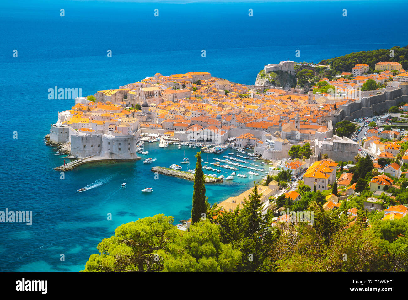 Panoramic aerial view of the historic town of Dubrovnik, one of the most famous tourist destinations in the Mediterranean Sea, from Srt mountain on a  Stock Photo