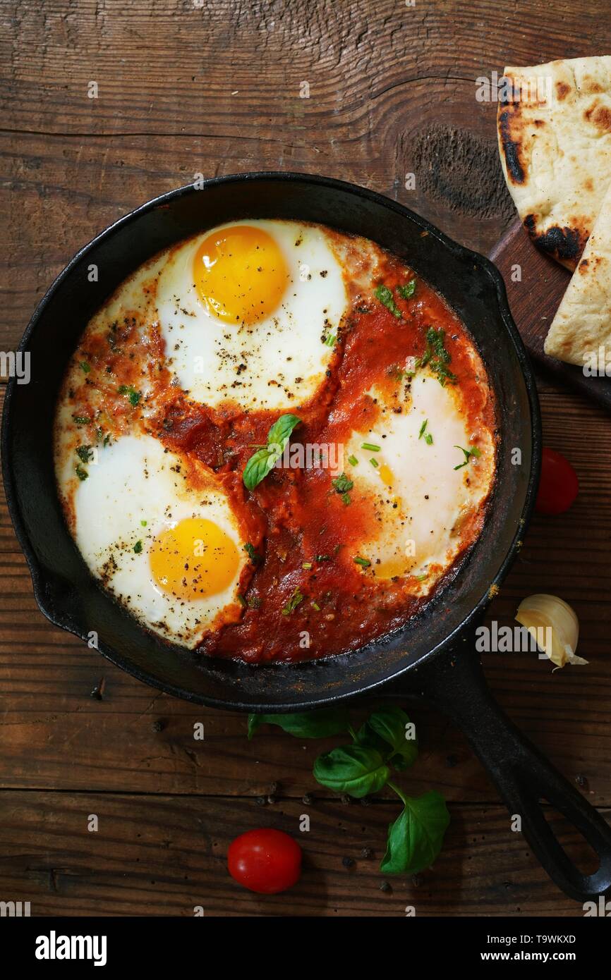 Homemade Shakshouka Middle Eastern breakfast Eggs poached in spicy