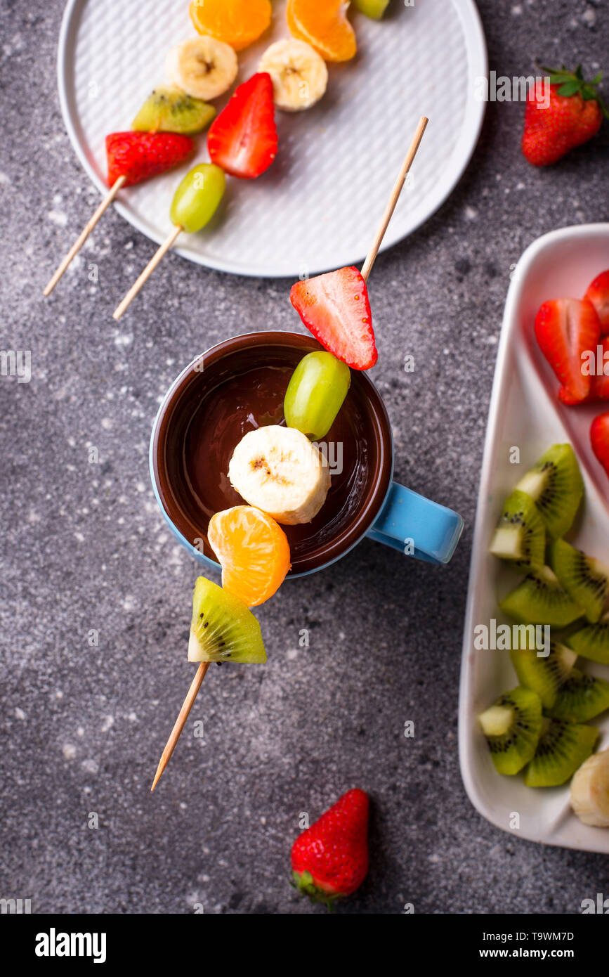 Sweet chocolate fondue with fruits Stock Photo Alamy