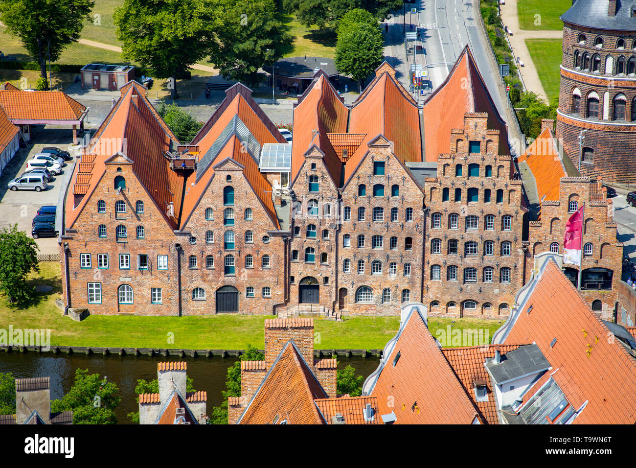 Beautiful view of famous historic Salzspeicher brick storehouse buildings on the Upper Trave River in central Luebeck on a scenic sunny day in summer, Stock Photo