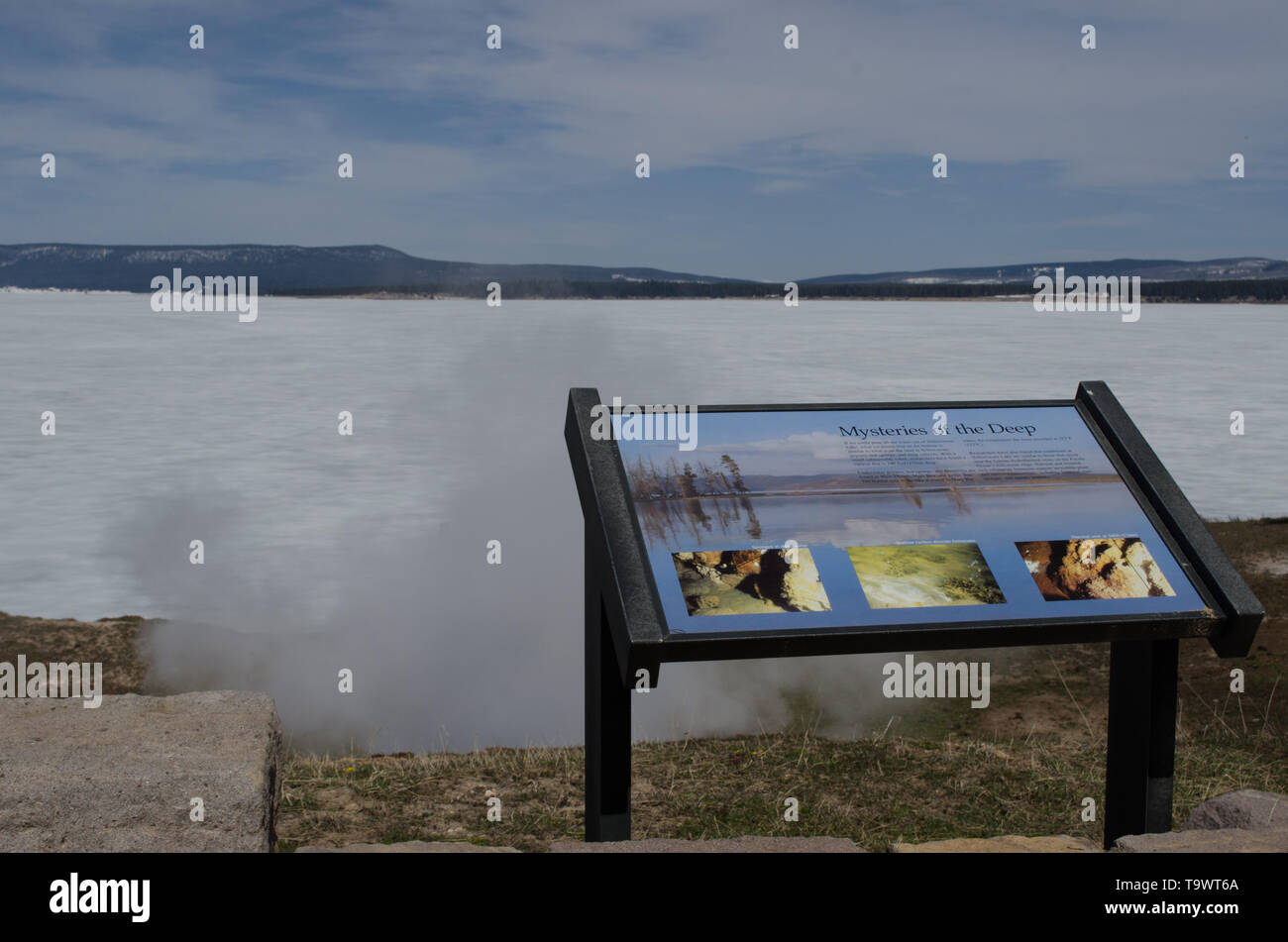 Yellowstone lake, still frozen over in late May, Steamboat Point hot spring Stock Photo