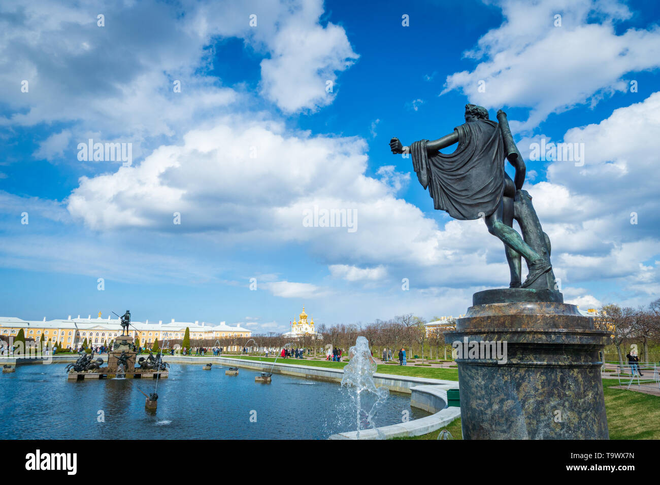 Saint Petersburg, Russia - May 2019: Peterhof fountains and palace view and tourists visiting. The Peterhof Palace is a popular spot for sightseeing. Stock Photo