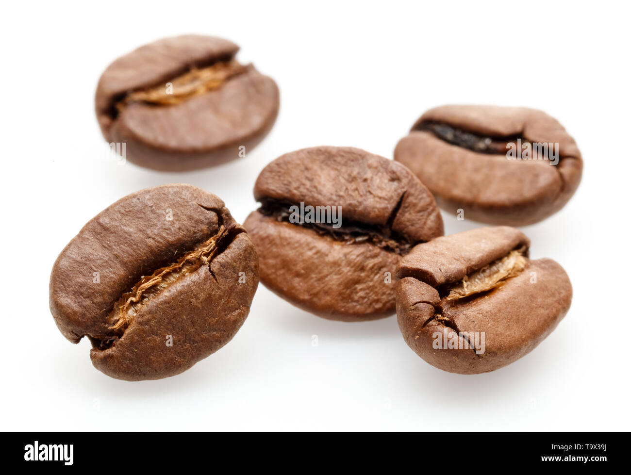 Roasted coffee beans isolated on white background Stock Photo - Alamy