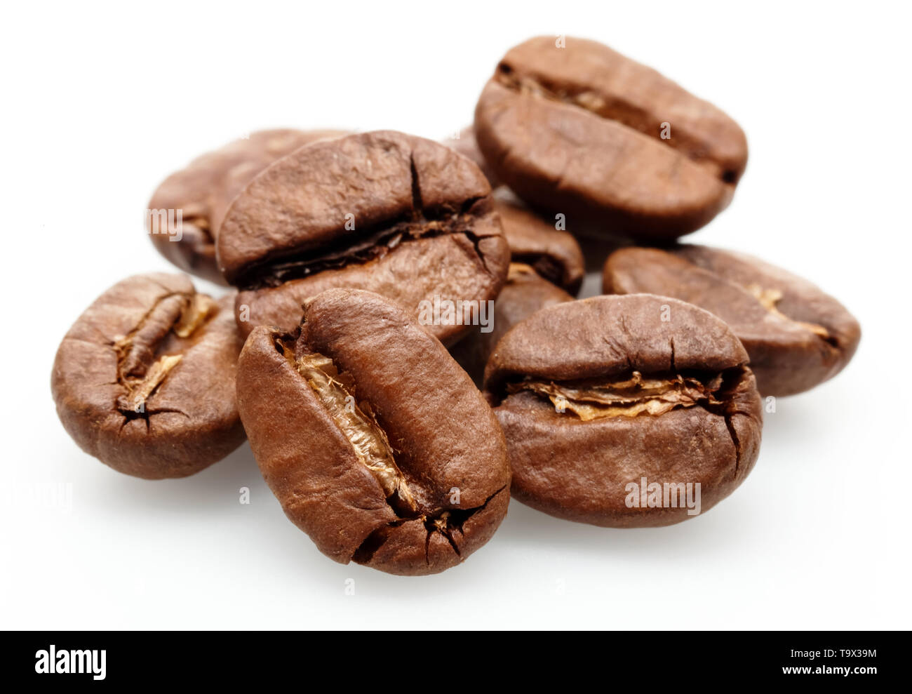 Roasted coffee beans isolated on white background Stock Photo - Alamy