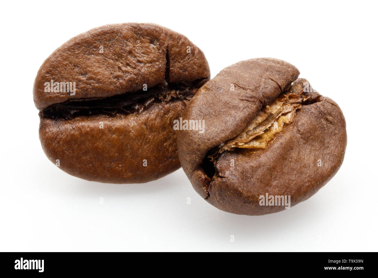 Roasted coffee beans isolated on white background Stock Photo - Alamy
