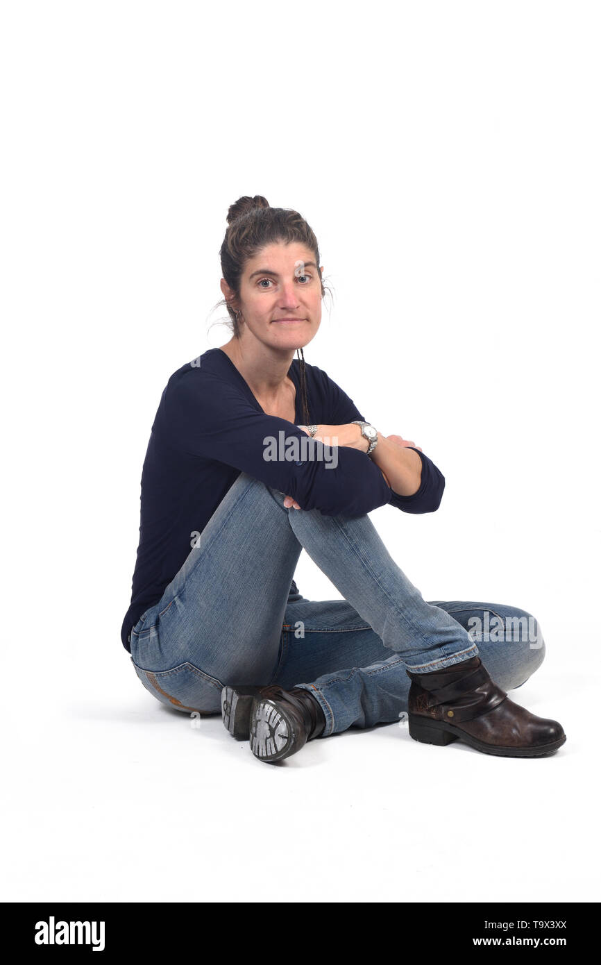 full portrait of woman sitting in the floor on white Stock Photo - Alamy