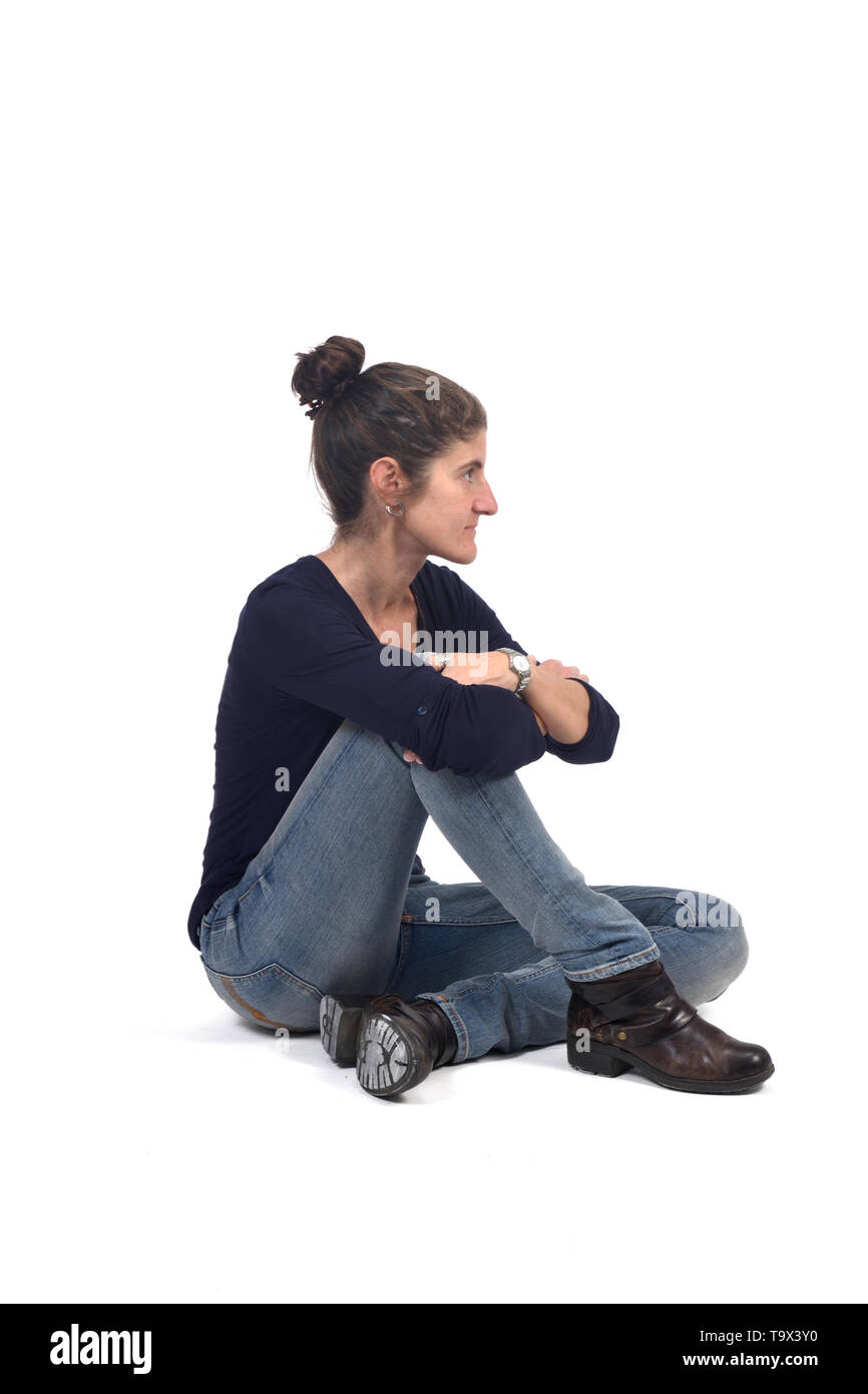 full portrait of woman sitting in the floor on white Stock Photo - Alamy